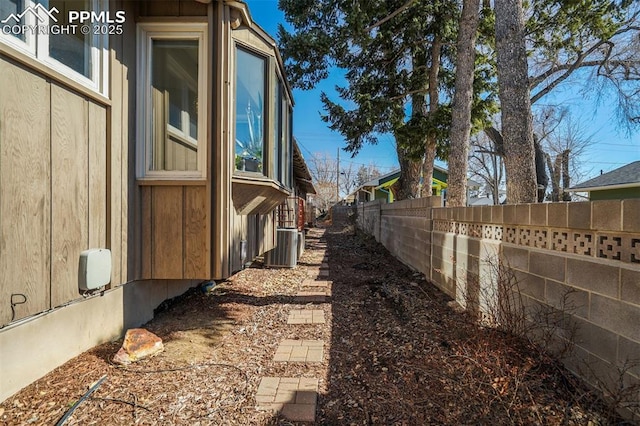 view of yard with central AC