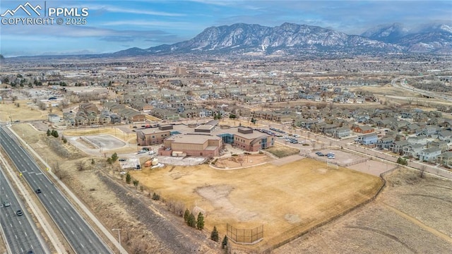 birds eye view of property featuring a mountain view