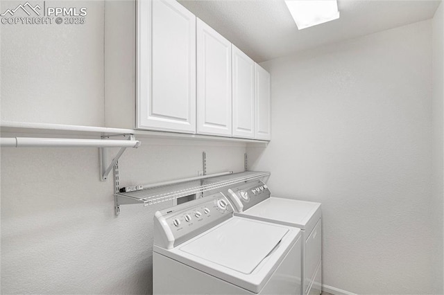 laundry area featuring cabinets and washer and dryer