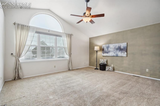 unfurnished living room featuring ceiling fan, high vaulted ceiling, and carpet