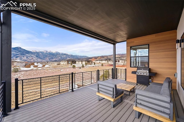 deck with a mountain view and a grill