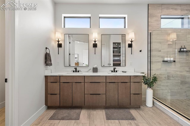 bathroom featuring vanity and a tile shower