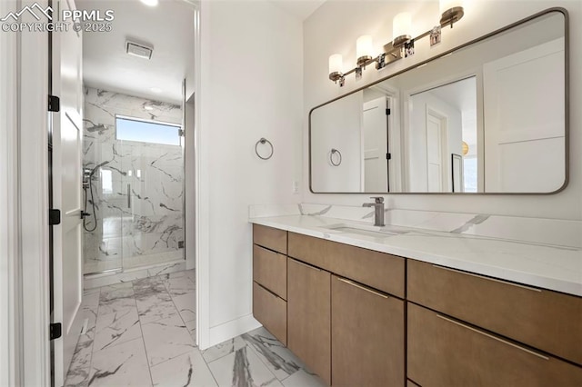 bathroom featuring vanity and an enclosed shower