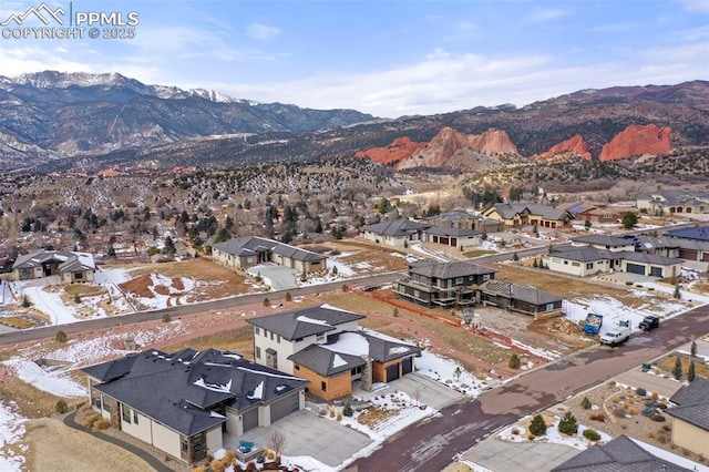 birds eye view of property with a mountain view