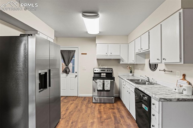 kitchen featuring stainless steel appliances, dark hardwood / wood-style flooring, sink, and white cabinets