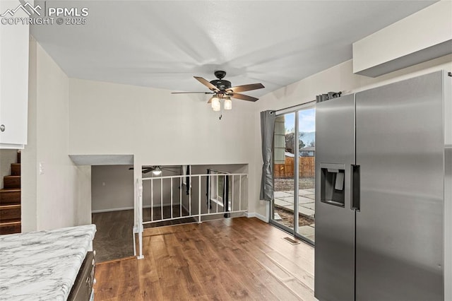 kitchen with ceiling fan, stainless steel fridge, and wood-type flooring