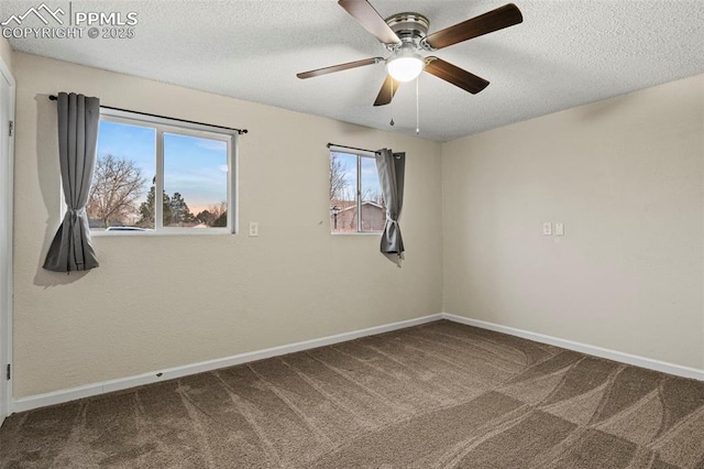 spare room with ceiling fan, carpet floors, and a textured ceiling