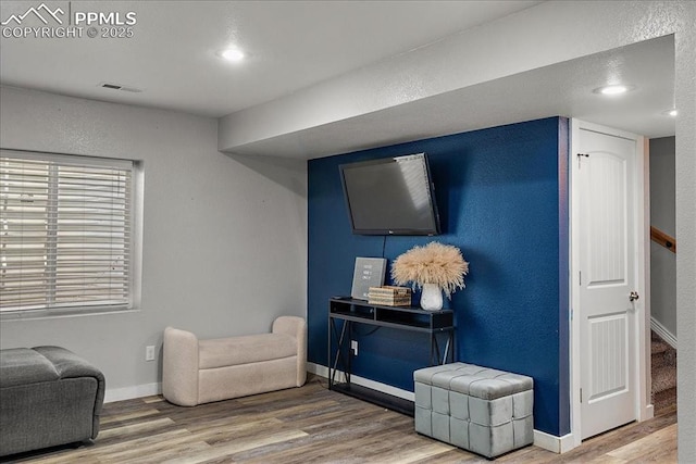 living area with wood-type flooring