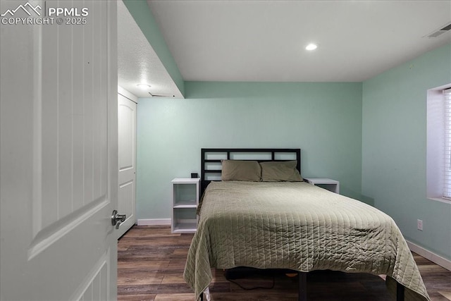 bedroom featuring dark hardwood / wood-style floors