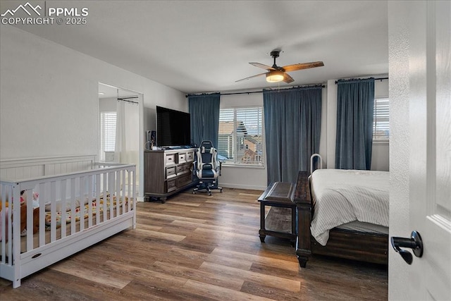 bedroom featuring ceiling fan and dark hardwood / wood-style flooring