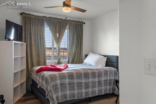 bedroom featuring dark wood-type flooring and ceiling fan