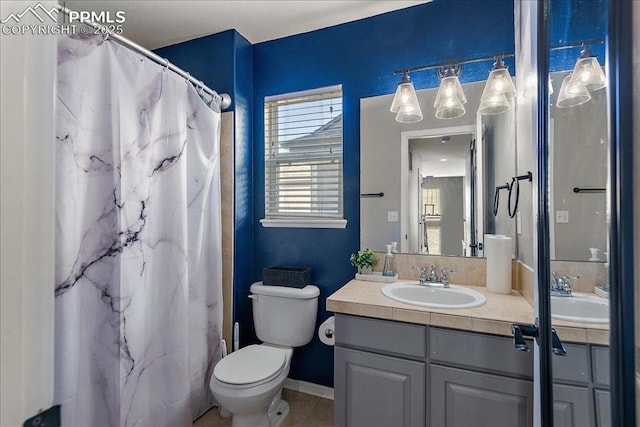 bathroom featuring walk in shower, tile patterned floors, toilet, and vanity