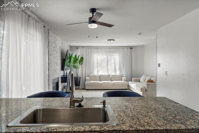 kitchen with ceiling fan and sink