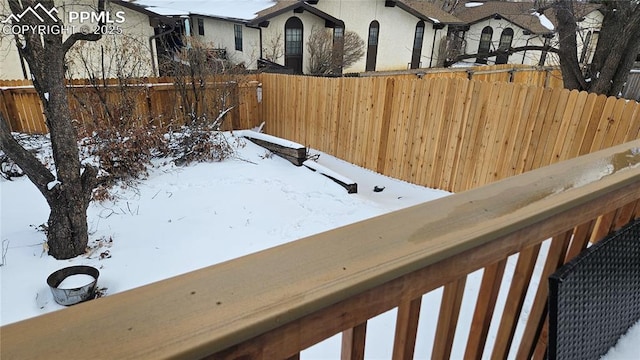 view of yard layered in snow