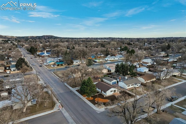 birds eye view of property with a residential view