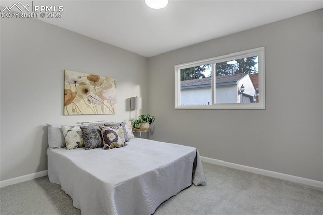 carpeted bedroom with baseboards