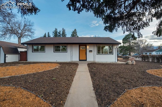 ranch-style home with an outbuilding and a storage unit