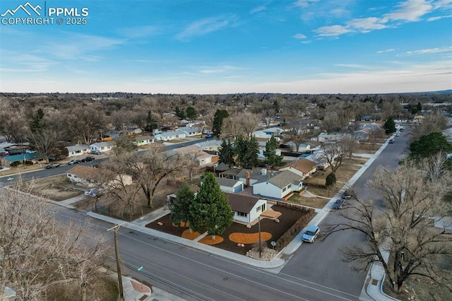 birds eye view of property with a residential view