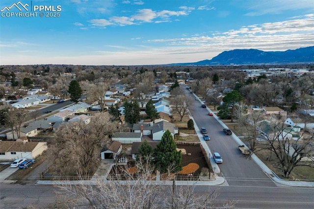 drone / aerial view featuring a mountain view and a residential view