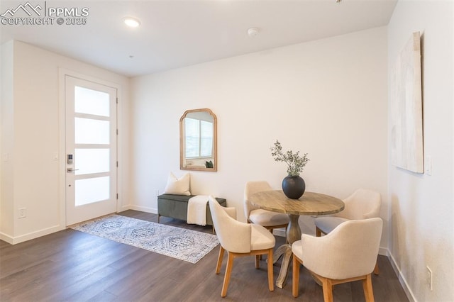 dining room with dark hardwood / wood-style flooring