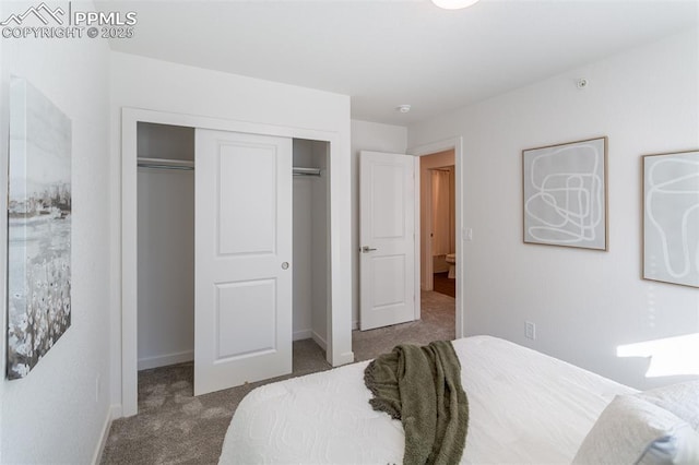 bedroom with dark carpet and a closet