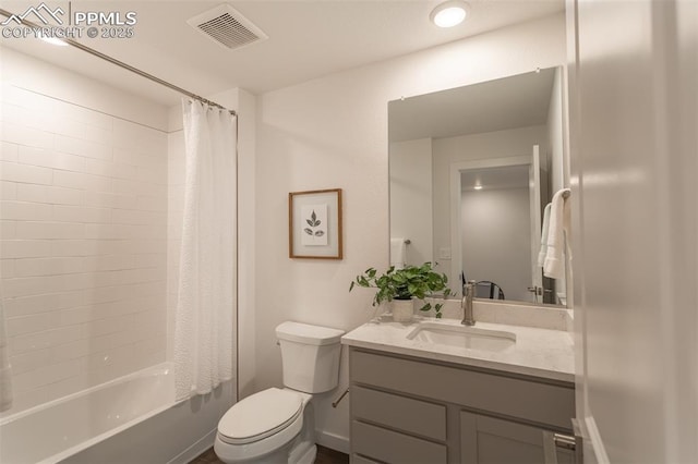 full bathroom featuring vanity, shower / tub combo with curtain, and toilet