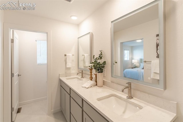 bathroom with vanity and tile patterned floors