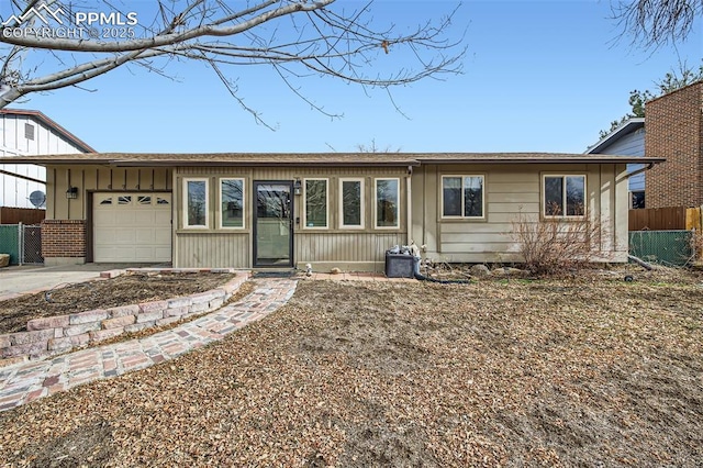 ranch-style home featuring a garage