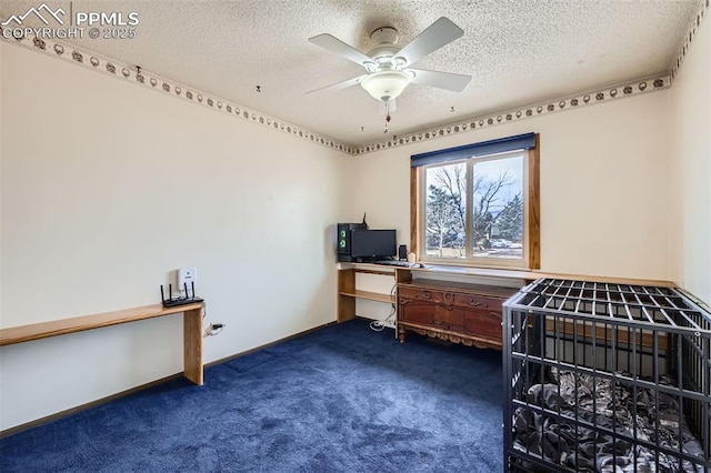 carpeted bedroom featuring ceiling fan and a textured ceiling