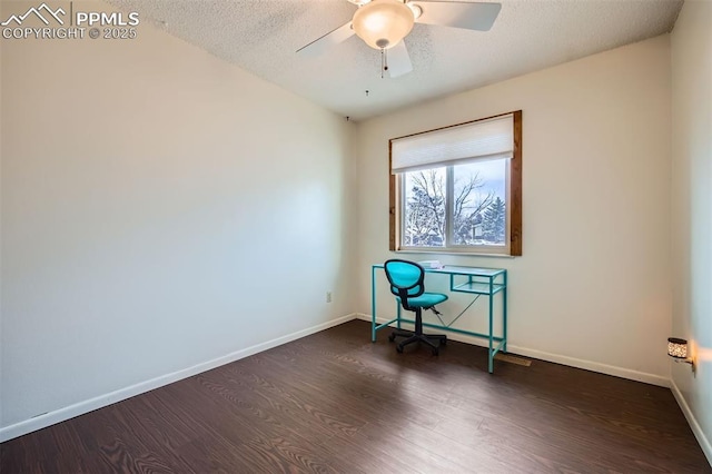 unfurnished office featuring ceiling fan, a textured ceiling, and dark hardwood / wood-style flooring