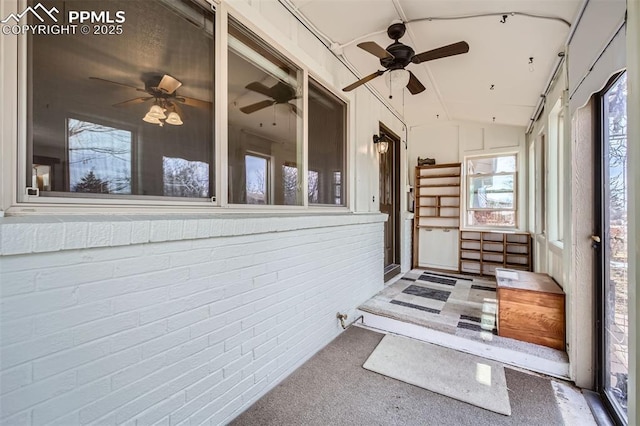 sunroom featuring vaulted ceiling