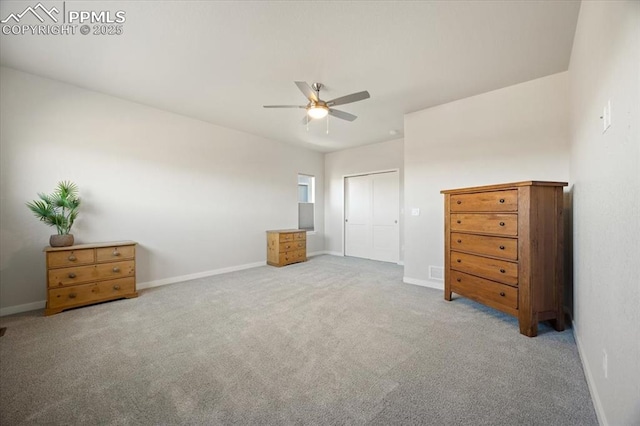 unfurnished bedroom featuring ceiling fan and light colored carpet