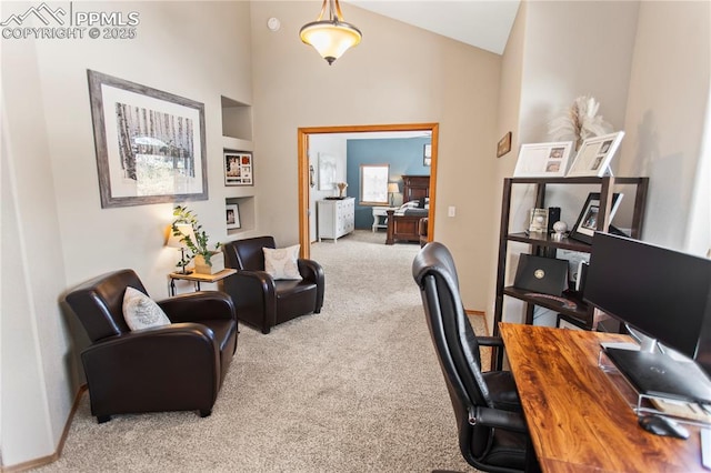 office space featuring carpet and high vaulted ceiling