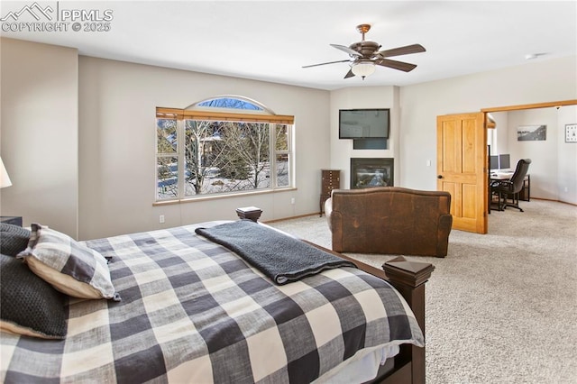 bedroom with light carpet and ceiling fan