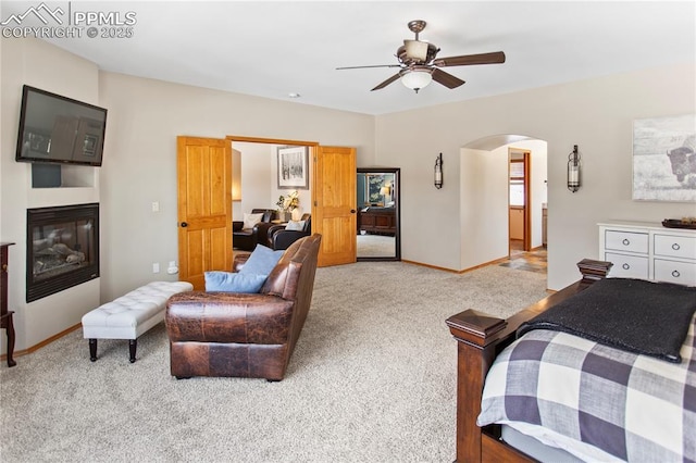 bedroom featuring light colored carpet and ceiling fan