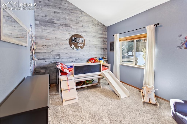 carpeted bedroom featuring vaulted ceiling and wood walls