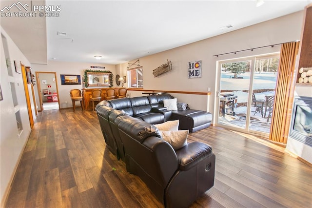 living room with dark wood-type flooring