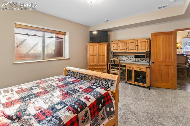 bedroom featuring light carpet