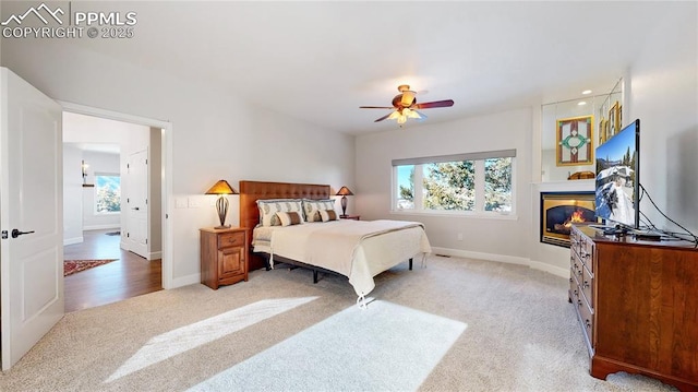 carpeted bedroom with ceiling fan