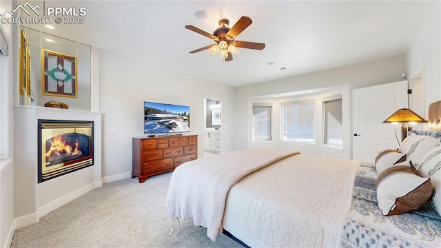 bedroom featuring ceiling fan and light colored carpet