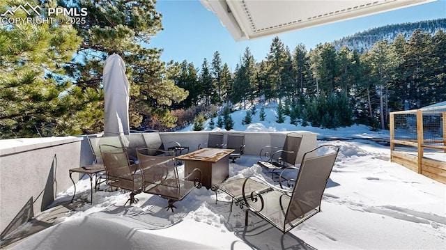 view of patio / terrace featuring a fire pit