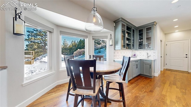 dining area with light hardwood / wood-style floors