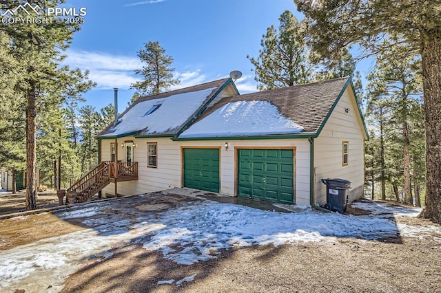 view of side of property featuring a garage