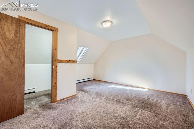 bonus room with carpet, vaulted ceiling with skylight, and baseboard heating