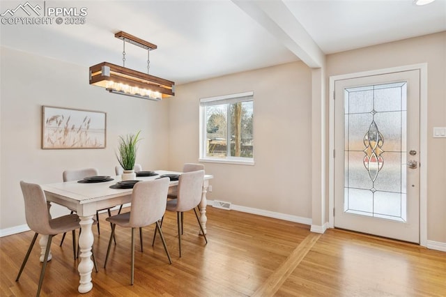 dining space featuring hardwood / wood-style floors