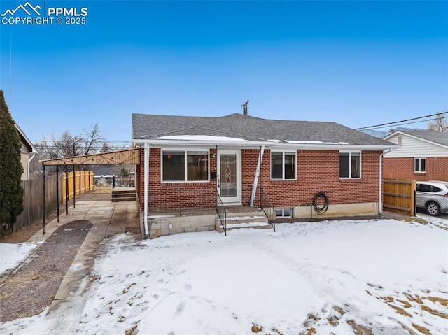 view of front of property with a carport