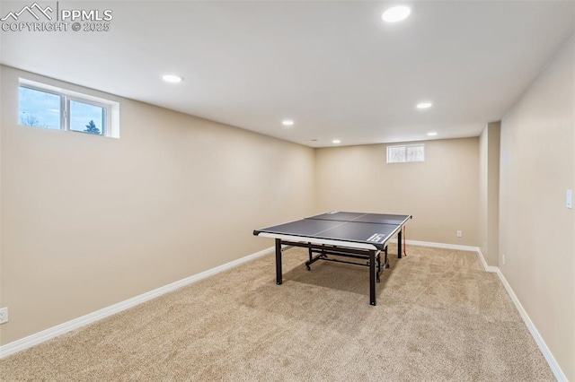 game room featuring a healthy amount of sunlight and light carpet