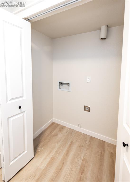 laundry room with hookup for a washing machine and light wood-type flooring