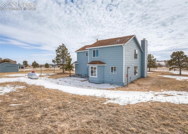 view of snow covered house