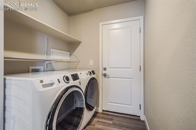 washroom with washer and dryer and dark hardwood / wood-style floors